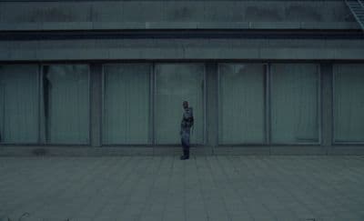 a person standing in front of a building
