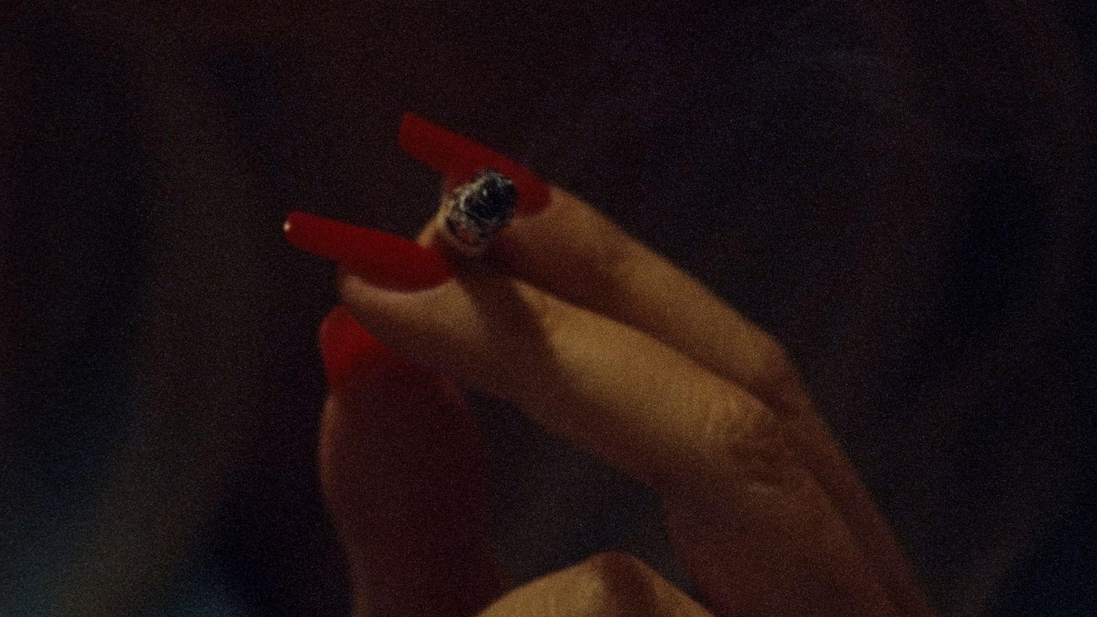 a woman's hand with a ring on it