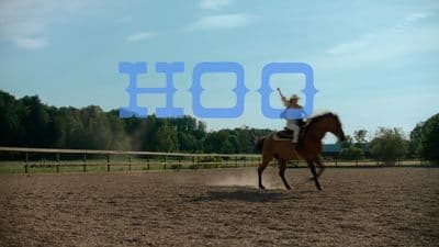 a man riding on the back of a brown horse