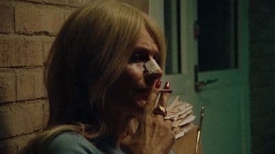 a woman holding a toothbrush in her mouth