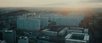 an aerial view of a city with tall buildings