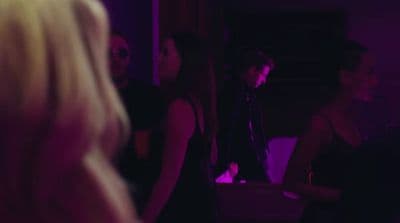 a group of people standing around in a room
