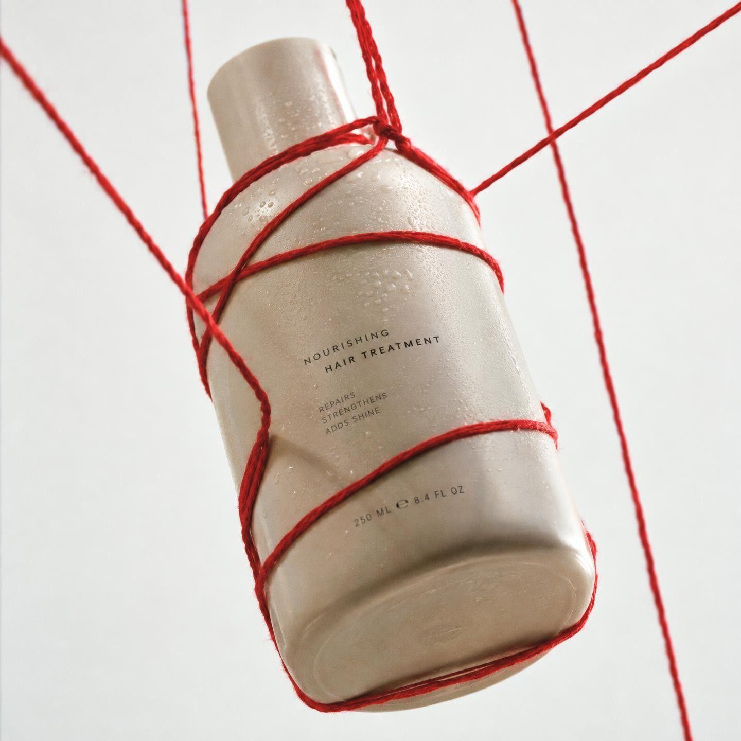Bottle wrapped in red string against a white backdrop, and a tan top-handle bag shot in the same style - Before