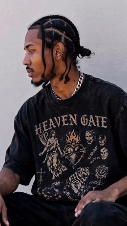 a man with dreadlocks sitting on the ground