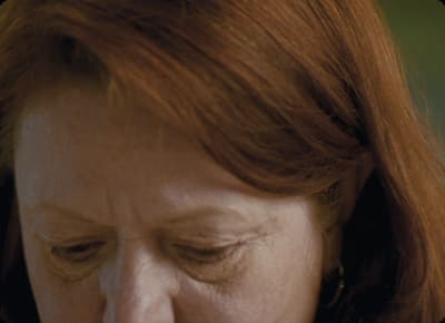 a close up of a woman with red hair