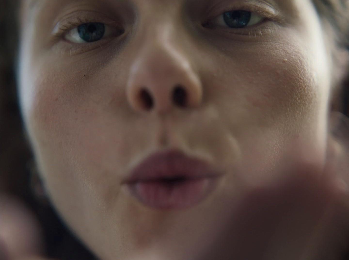 a close up of a woman making a face