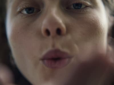 a close up of a woman making a face