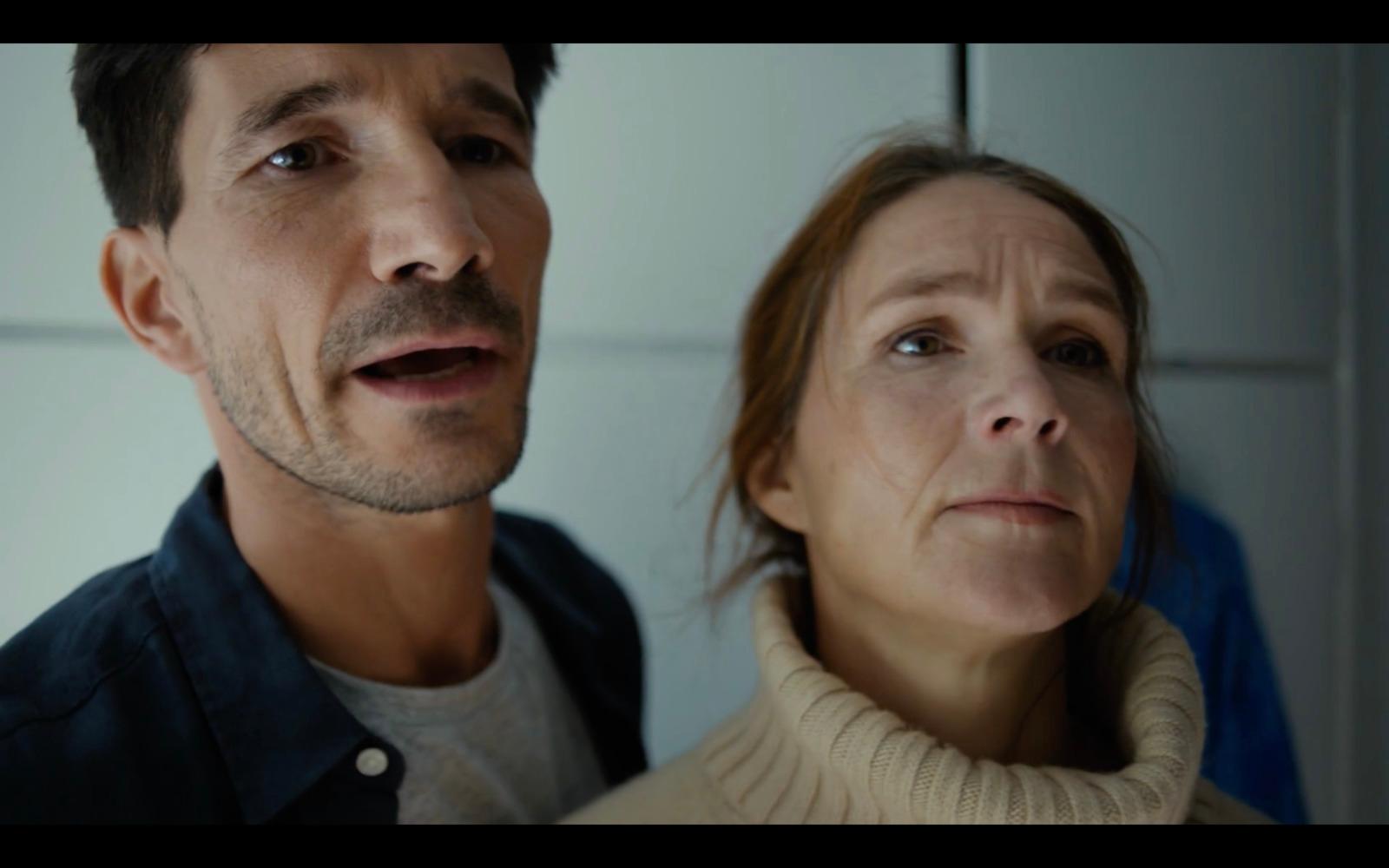 a man and a woman standing next to each other