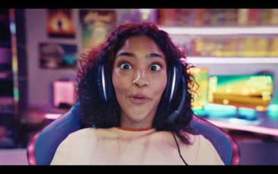 a woman wearing headphones making a funny face