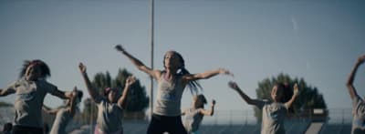 a group of young women standing next to each other
