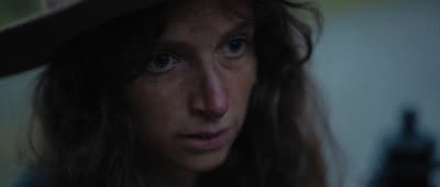 a close up of a person wearing a hat