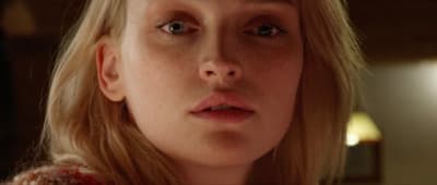 a close up of a person with long blonde hair