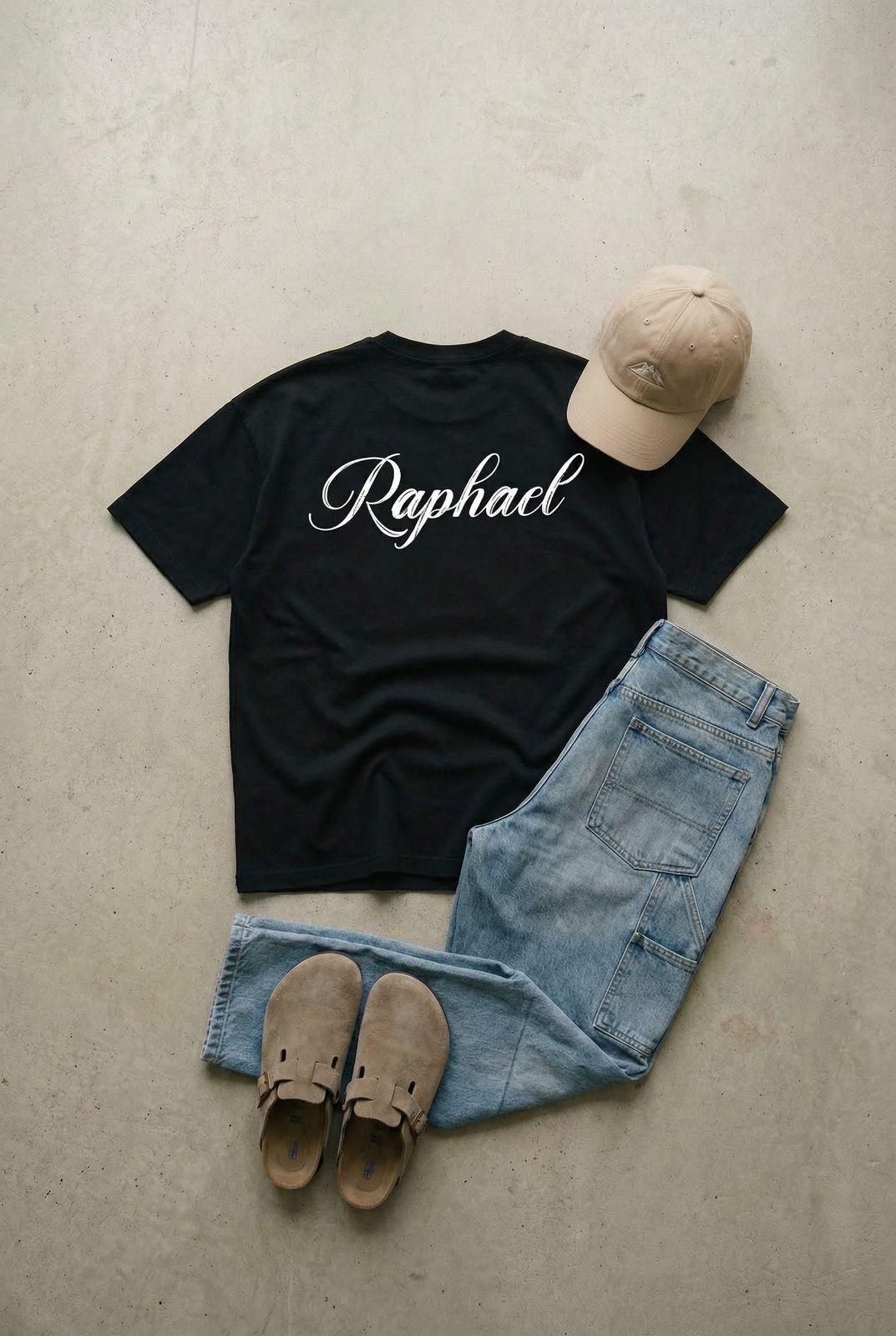 a t - shirt, jeans, and hat are laid out on the floor