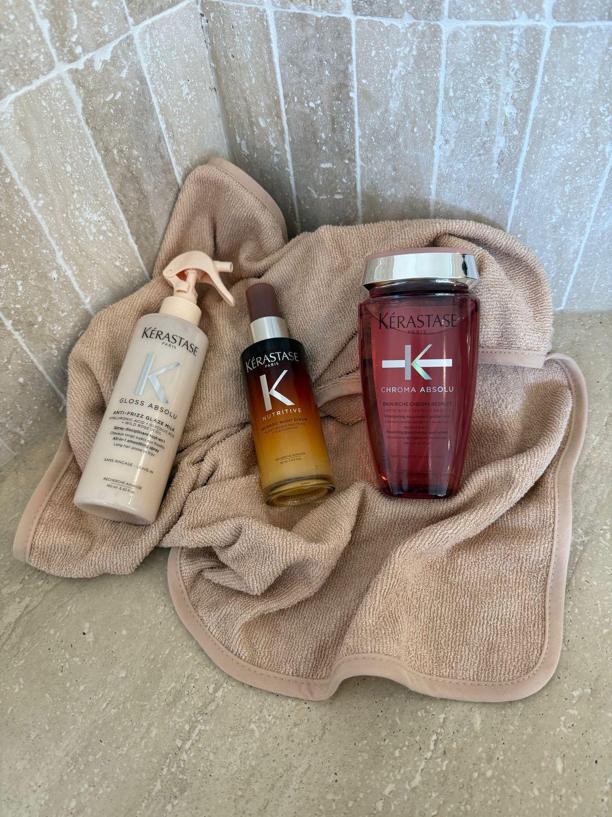 a bottle of kerastan and a bottle of kerastan on a towel