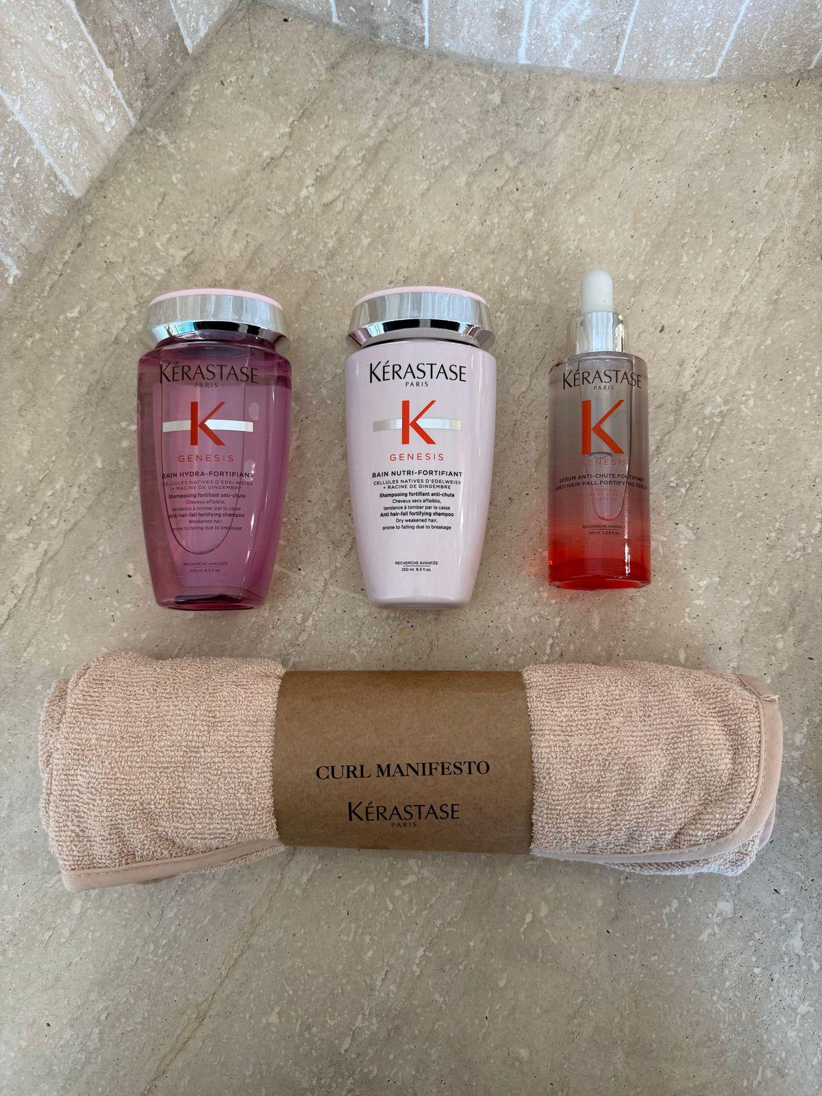 three bottles of kerastan and a towel on the floor