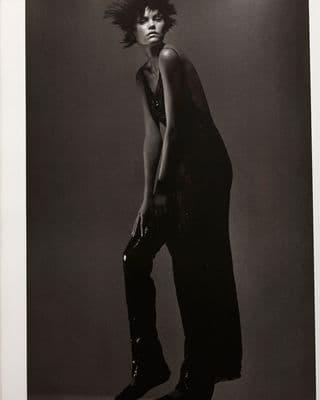 a black and white photo of a woman posing