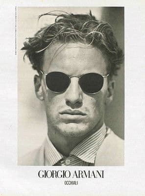 a black and white photo of a man wearing sunglasses