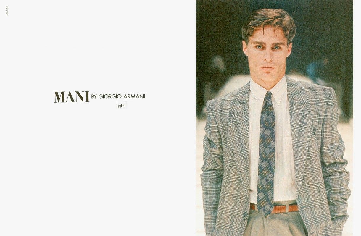 a man is wearing a suit and tie