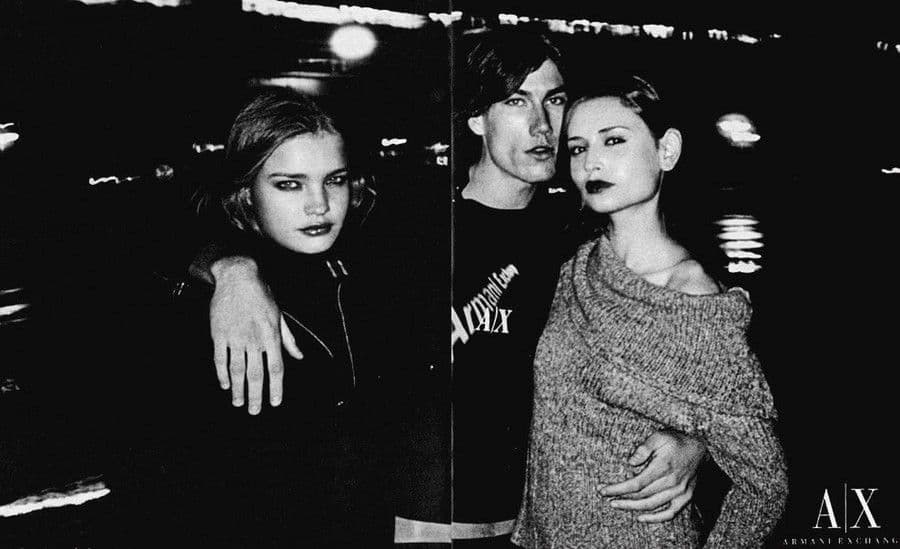 a black and white photo of three people