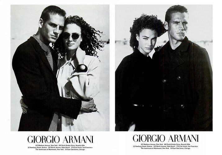 a black and white photo of two men and a woman