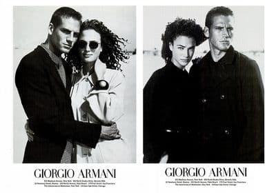 a black and white photo of two men and a woman