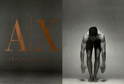 a man standing in front of a wall with the word ajax on it