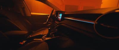 the interior of a car with the sun shining through the window