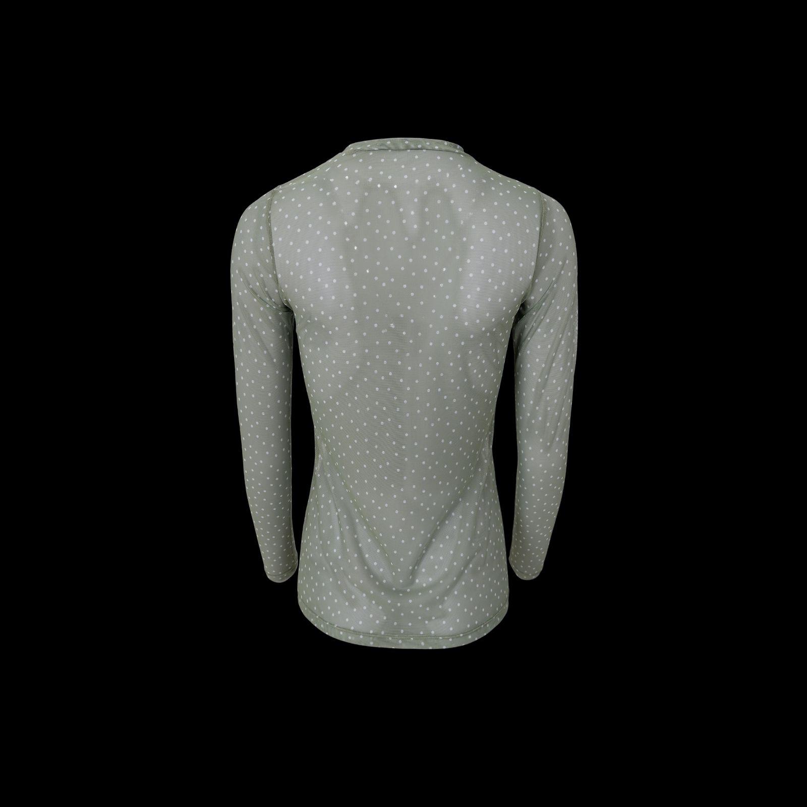 a woman's shirt with a polka dot pattern