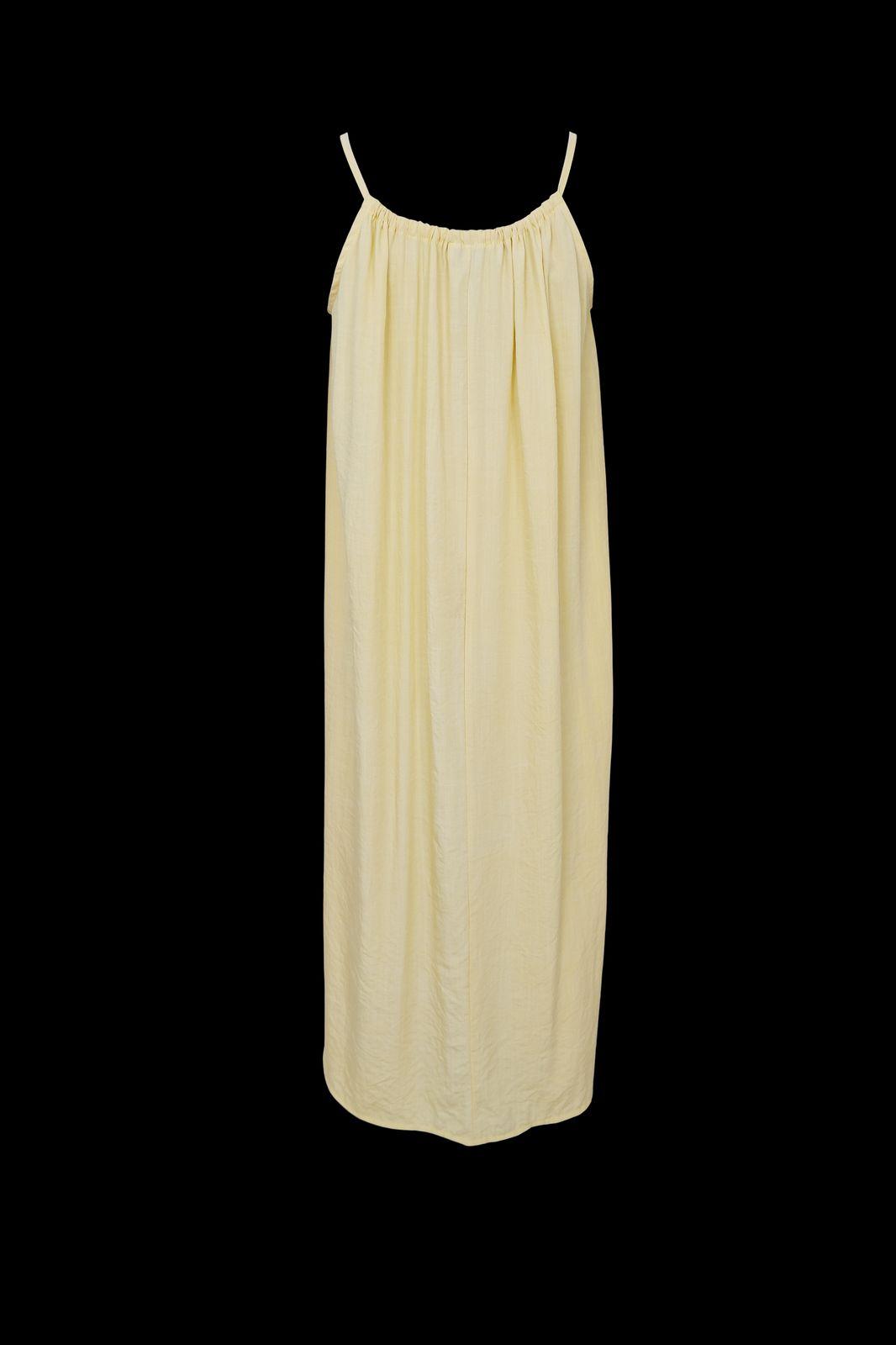 a yellow dress on a black background