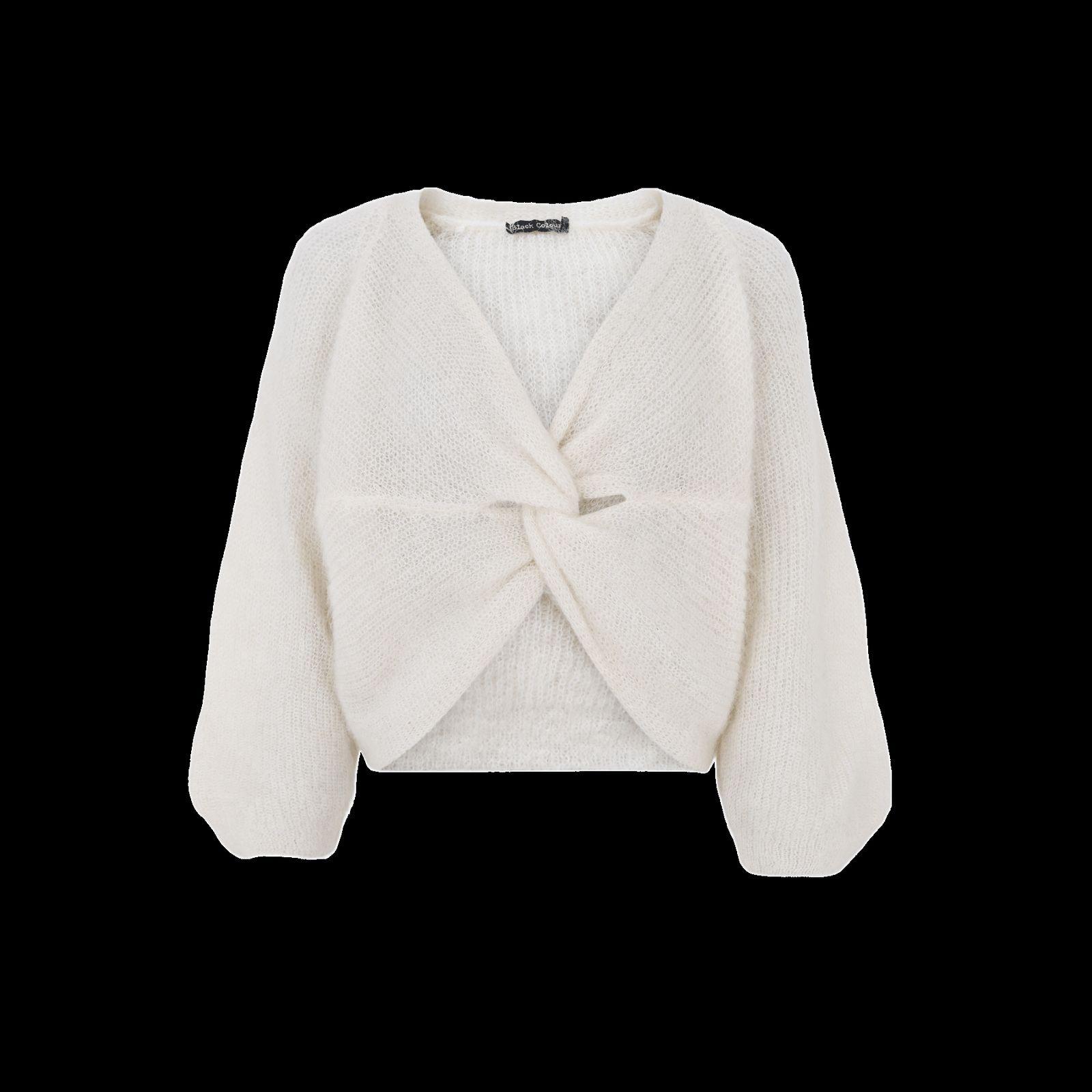 a white sweater with a bow on the front