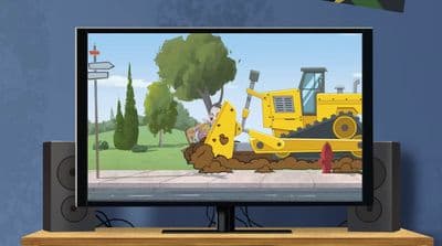 a flat screen tv sitting on top of a wooden table