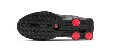 a pair of black and red shoes on a white background