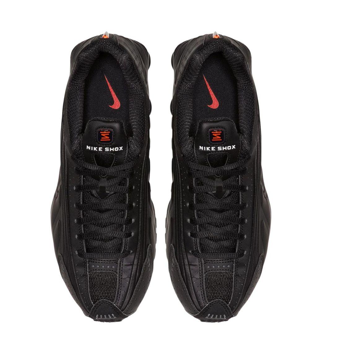 a pair of black and red nike sneakers