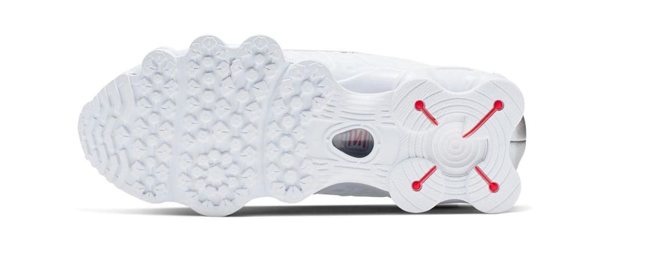 a close up of a white and red shoe
