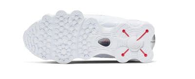 a close up of a white and red shoe
