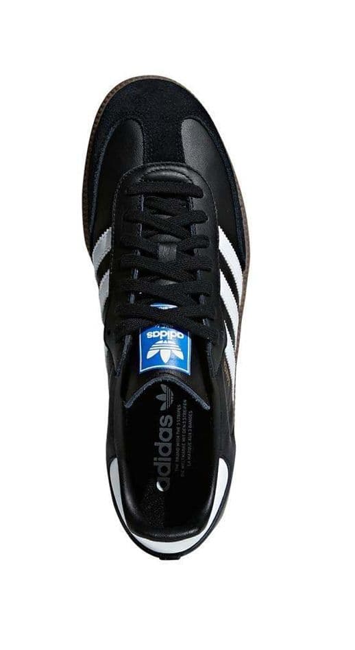 a black and white adidas sneakers on a white background