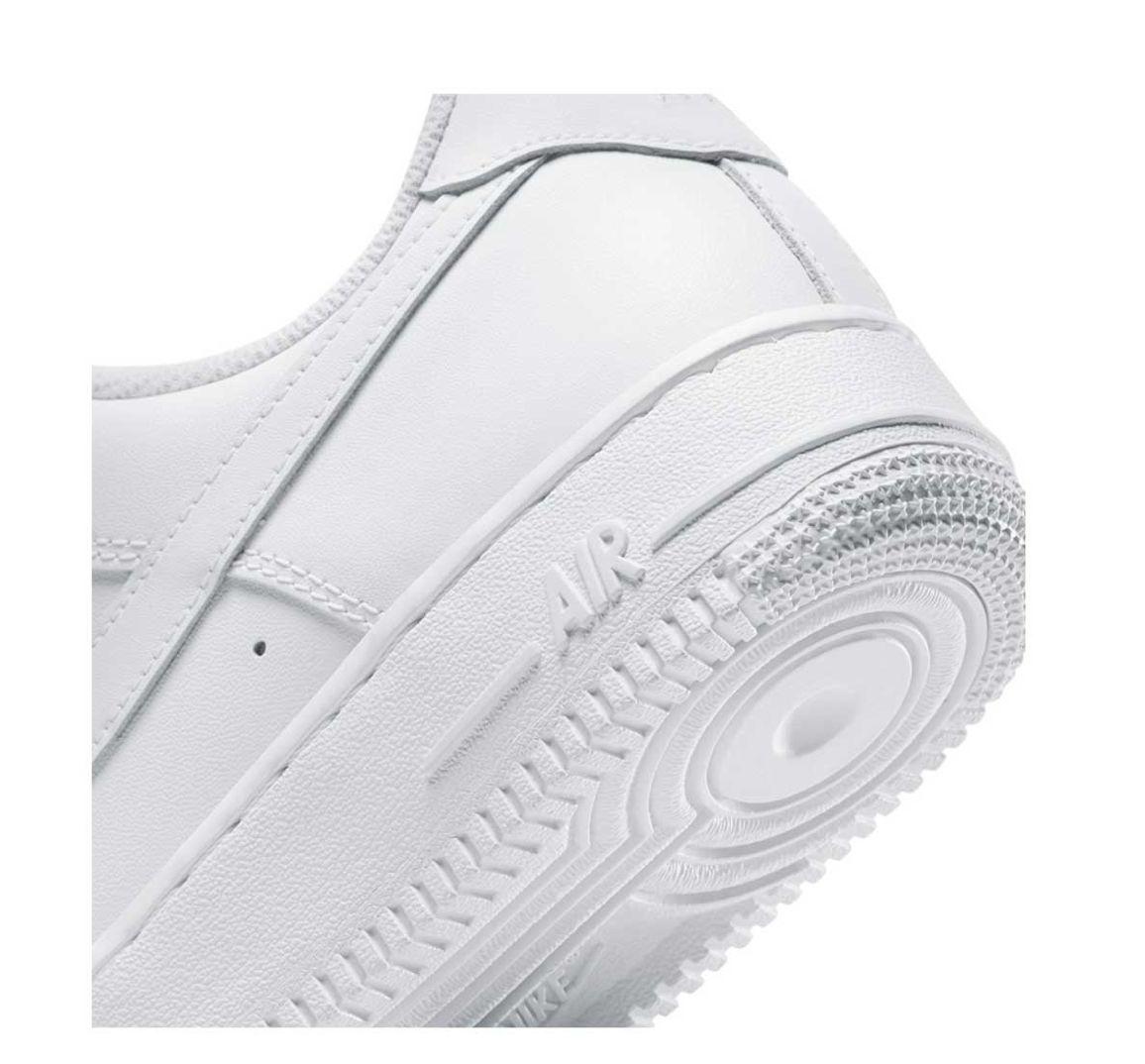 a pair of white sneakers on a white background