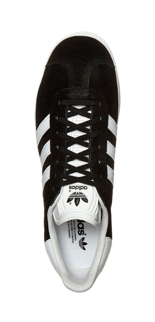 a black and white adidas sneakers on a white background
