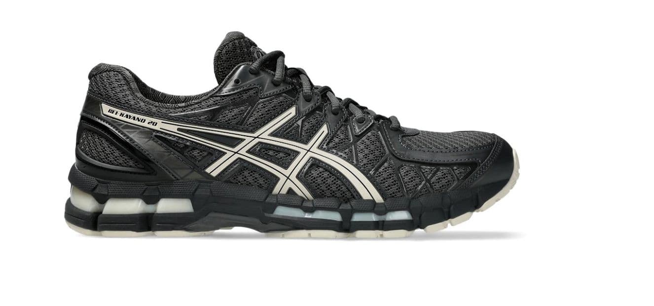 a black and white running shoe on a white background