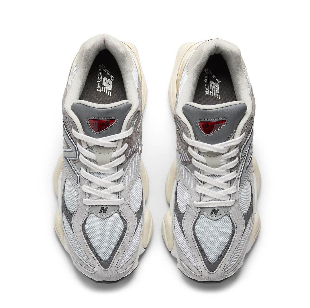 a pair of white and grey sneakers on a white background