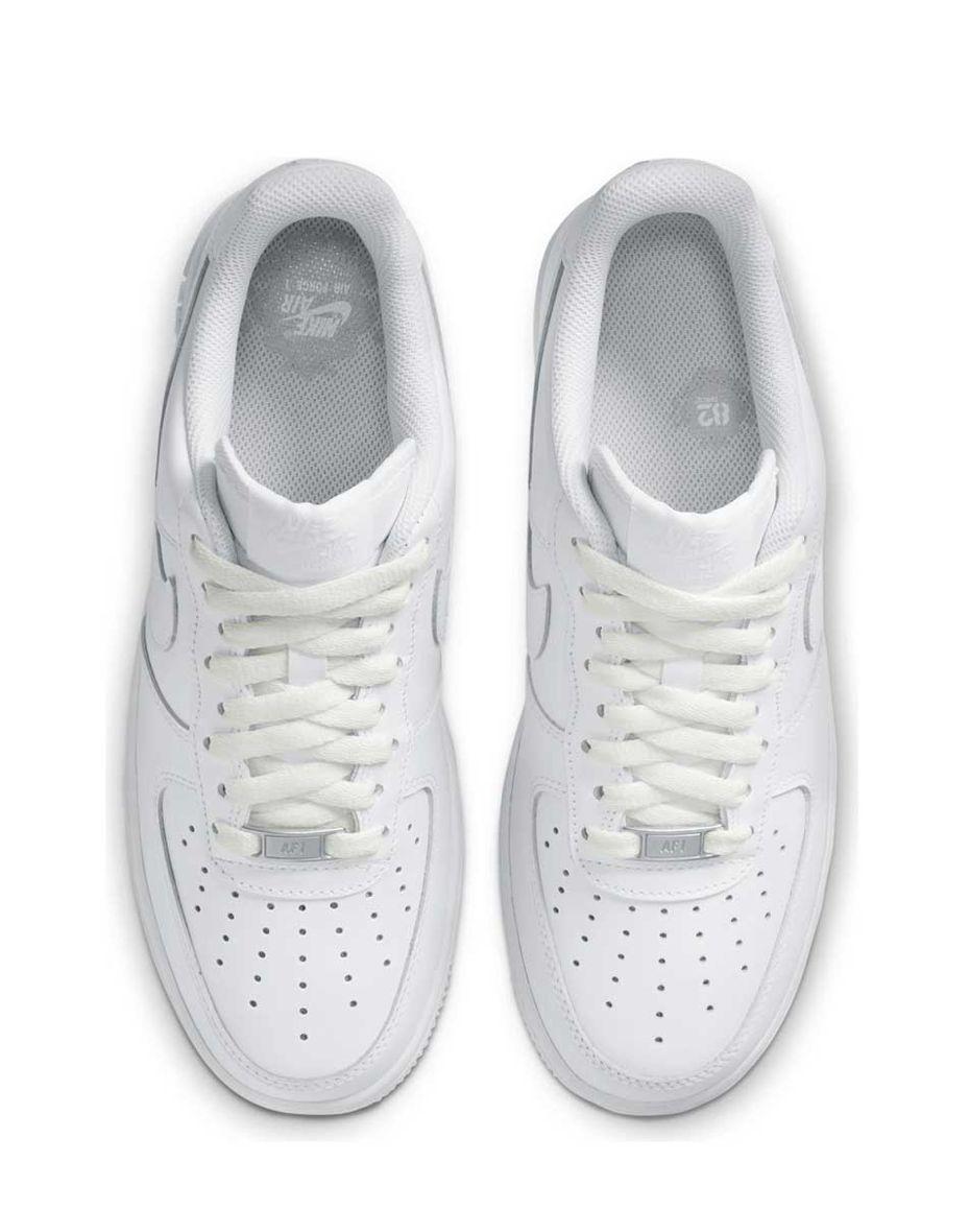 a pair of white sneakers on a white background