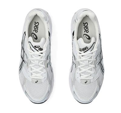 a pair of white sneakers with black accents