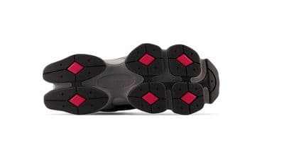 a pair of black and red shoes on a white background