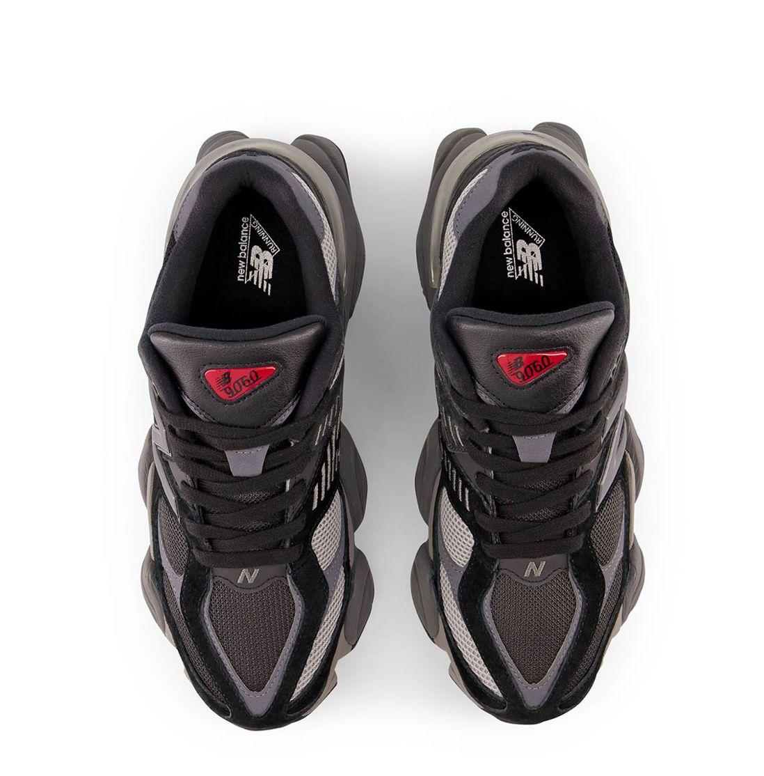 a pair of black and grey sneakers on a white background