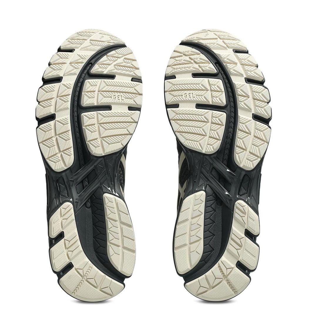 a pair of black and white shoes on a white background