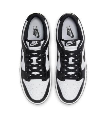 a pair of black and white sneakers on a white background