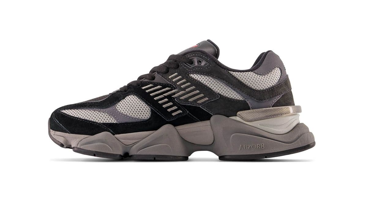 a black and grey sneaker on a white background