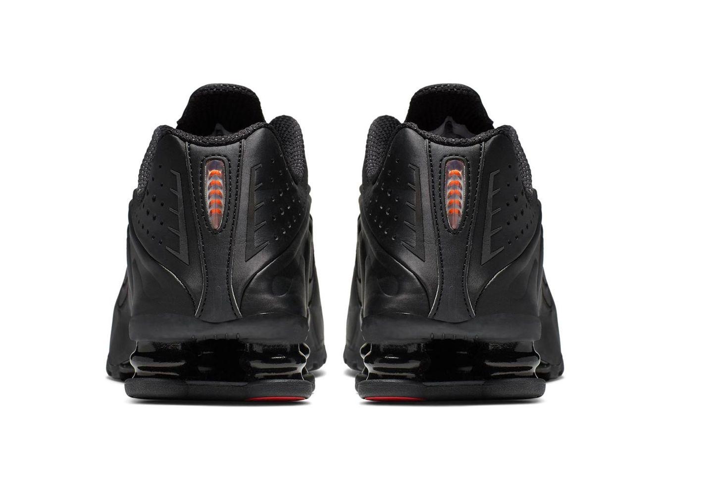 a pair of black shoes on a white background