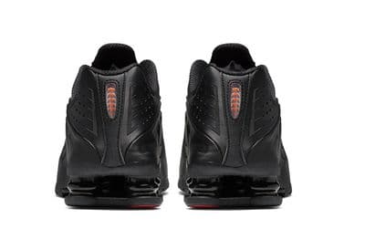 a pair of black shoes on a white background