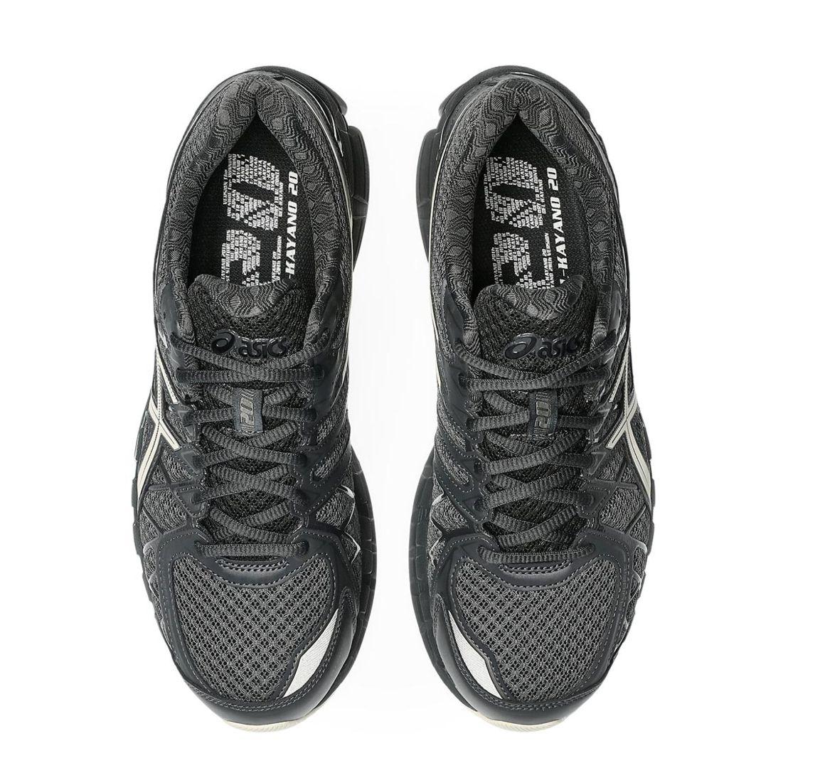a pair of black and white running shoes